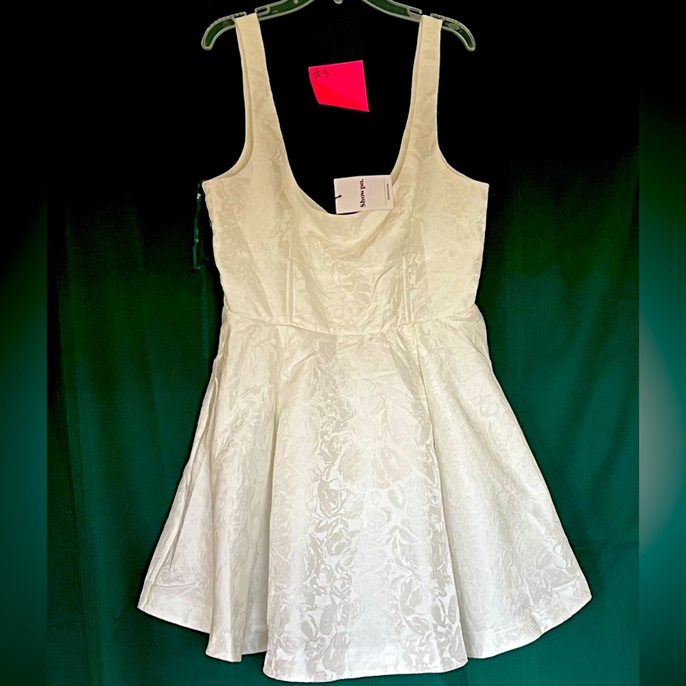 Showpo, women’s size 10, white dress with full skirt, great for bridal event.